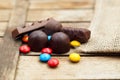 Colored chocolate sweets ÃâÃâÃÂ² candy on a wooden background